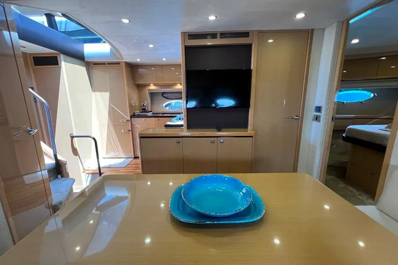  Yacht Photos Pics Luxurious 2010 Princess V62 yacht interior with modern kitchen and dining area.