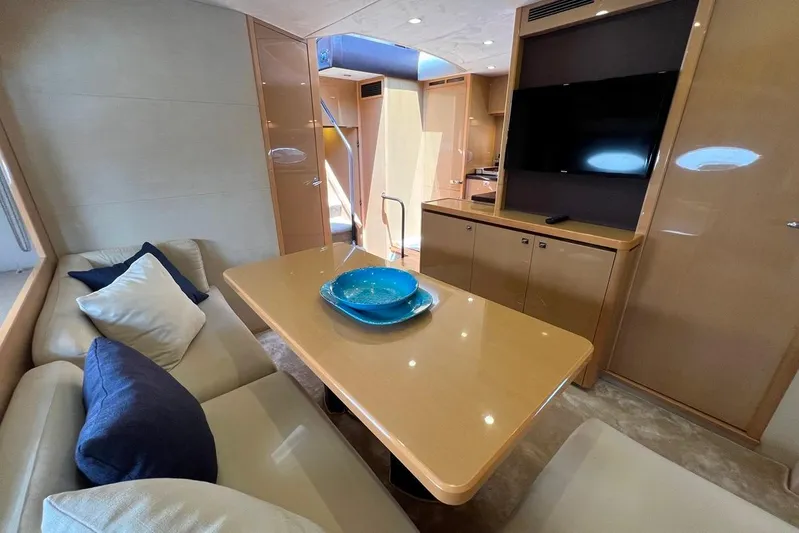  Yacht Photos Pics Luxurious interior of 2010 Princess V62 yacht with elegant seating and modern amenities.