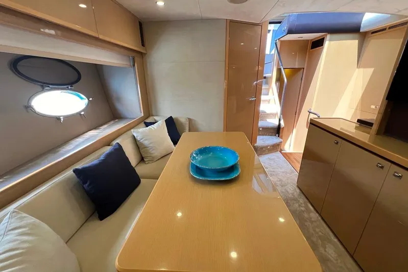  Yacht Photos Pics Luxurious interior of 2010 Princess V62 yacht with elegant seating and dining area.