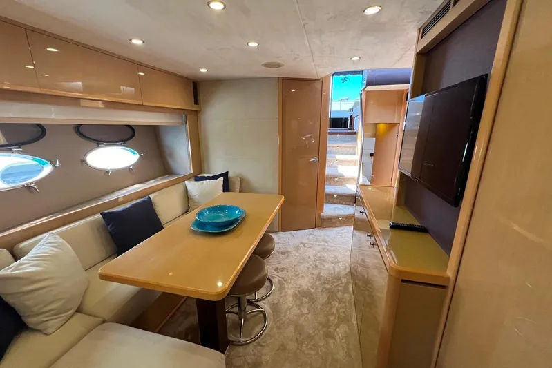 Yacht Photos Pics Luxurious interior of 2010 Princess V62 yacht with dining area and modern decor.