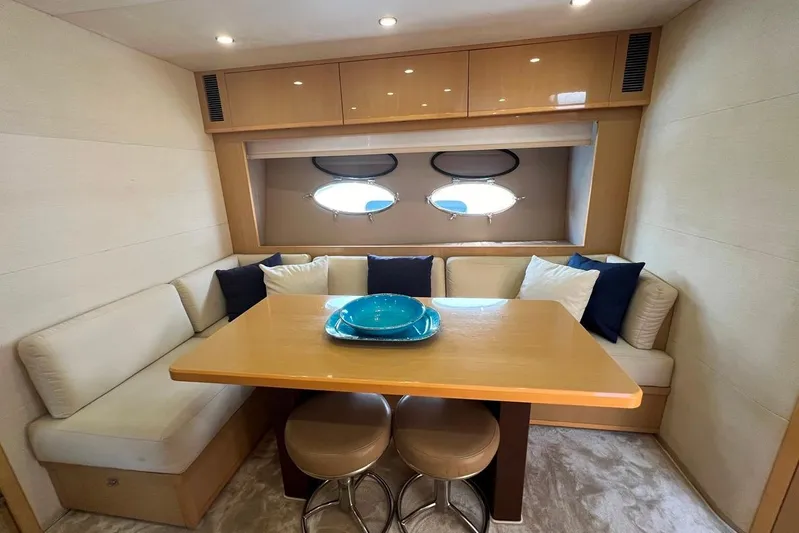  Yacht Photos Pics Luxurious 2010 Princess V62 yacht interior with cozy dining area and elegant decor.