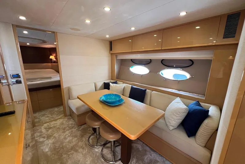  Yacht Photos Pics Luxurious interior of 2010 Princess V62 yacht with cozy seating and elegant decor.
