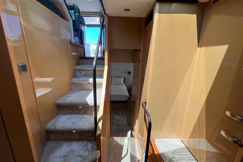  Yacht Photos Pics Interior of 2010 Princess V62 yacht with carpeted stairs and modern design.