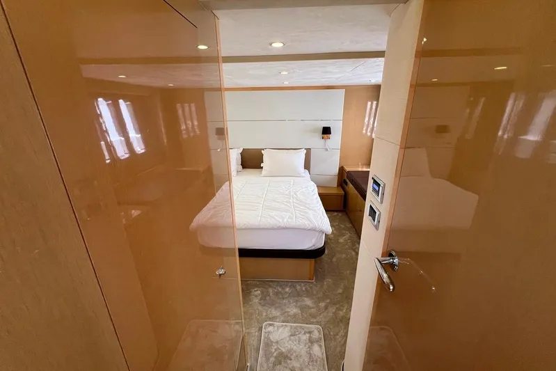  Yacht Photos Pics Luxurious bedroom interior of 2010 Princess V62 yacht with modern design and cozy ambiance.