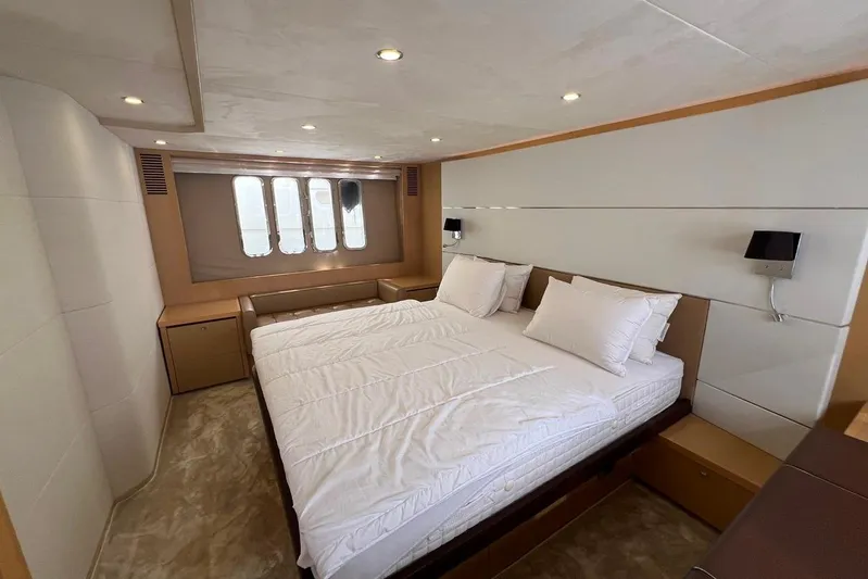  Yacht Photos Pics Luxurious bedroom interior of 2010 Princess V62 yacht with modern design and cozy bedding.