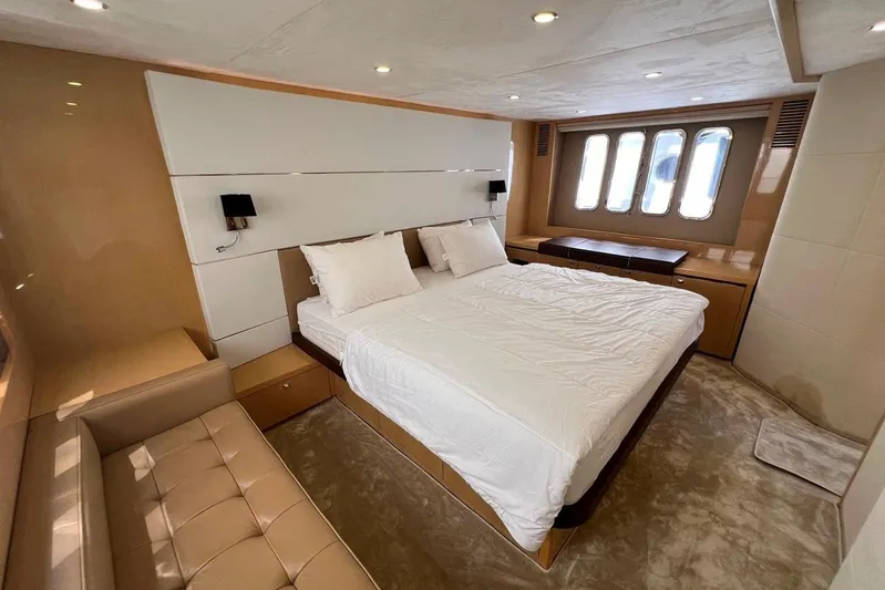  Yacht Photos Pics Luxurious bedroom interior of 2010 Princess V62 yacht with modern design and elegant furnishings.