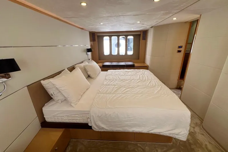  Yacht Photos Pics Luxurious bedroom interior of 2010 Princess V62 yacht with elegant bedding and modern design.