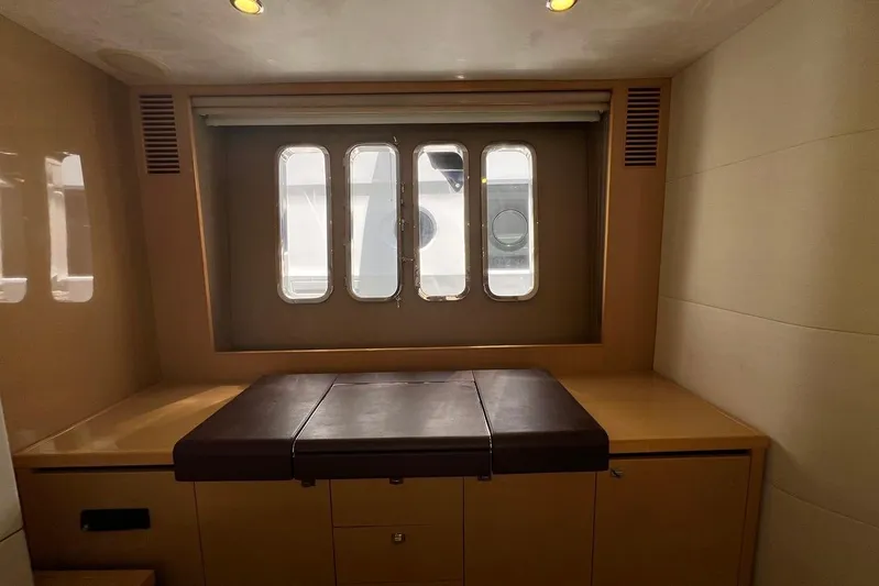  Yacht Photos Pics Interior of 2010 Princess V62 yacht with window and seating area.