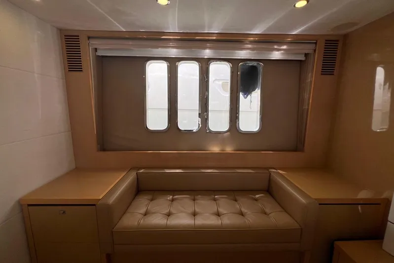  Yacht Photos Pics Luxurious interior of 2010 Princess V62 yacht with leather seating and large windows.