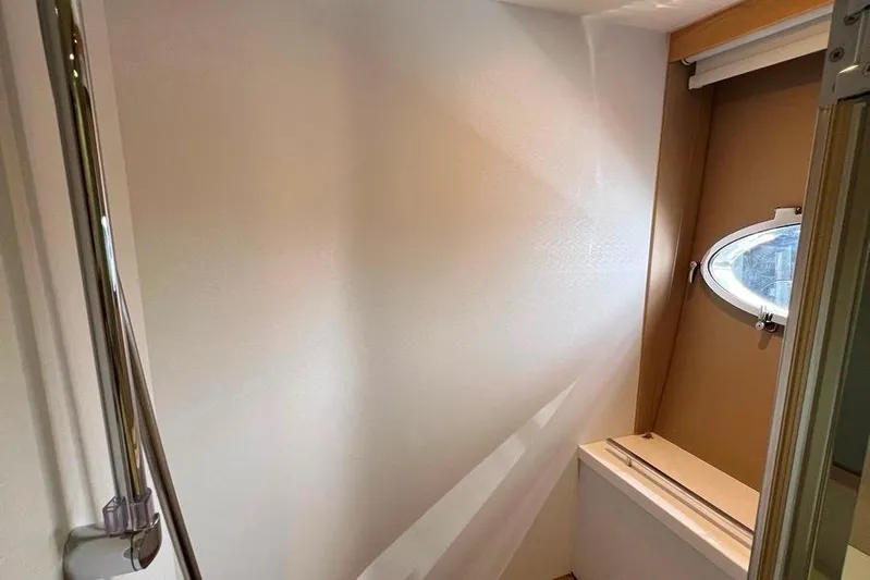  Yacht Photos Pics Interior of 2010 Princess V62 yacht, featuring a porthole window and sleek design elements.