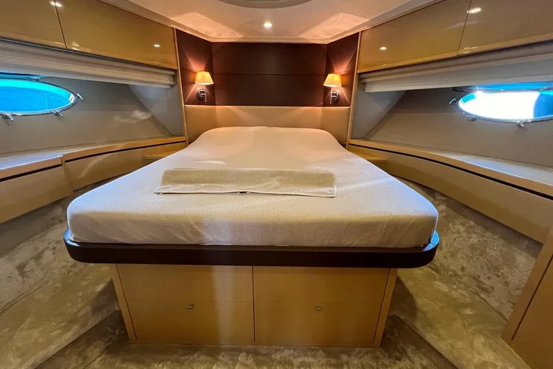  Yacht Photos Pics Luxurious 2010 Princess V62 yacht bedroom with elegant lighting and modern design.