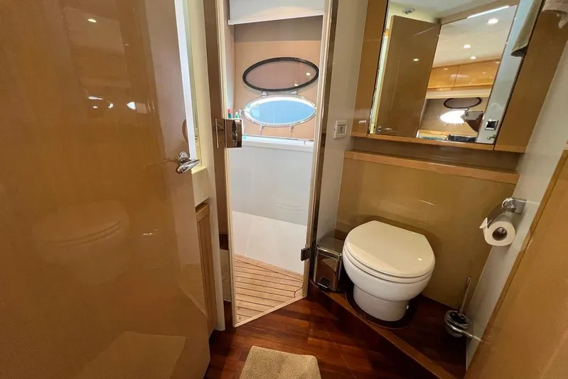  Yacht Photos Pics Luxurious bathroom interior of 2010 Princess V62 yacht, featuring modern amenities and elegant design.