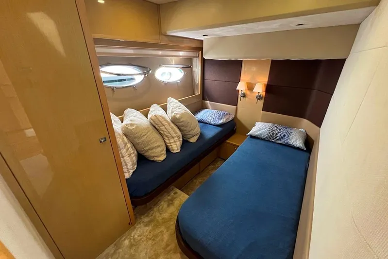  Yacht Photos Pics Luxurious twin cabin interior of 2010 Princess V62 yacht with elegant bedding.