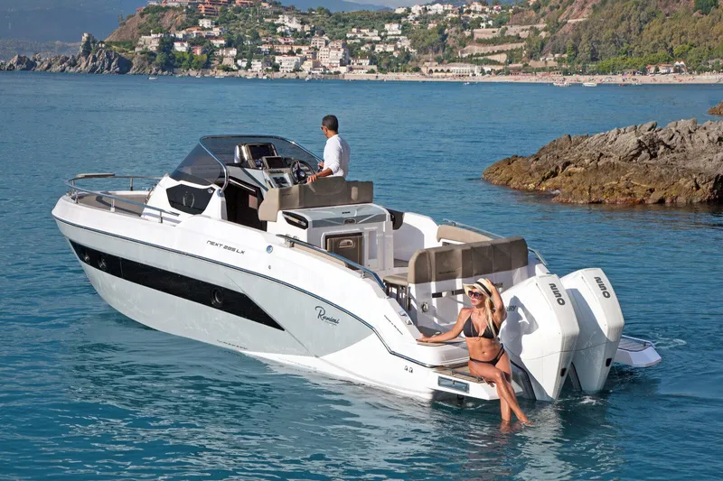  Yacht Photos Pics 2025 Ranieri NEXT 285 XL boat cruising near scenic coastline.