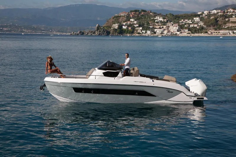  Yacht Photos Pics 2025 Ranieri NEXT 285 XL boat cruising on scenic coastal waters.