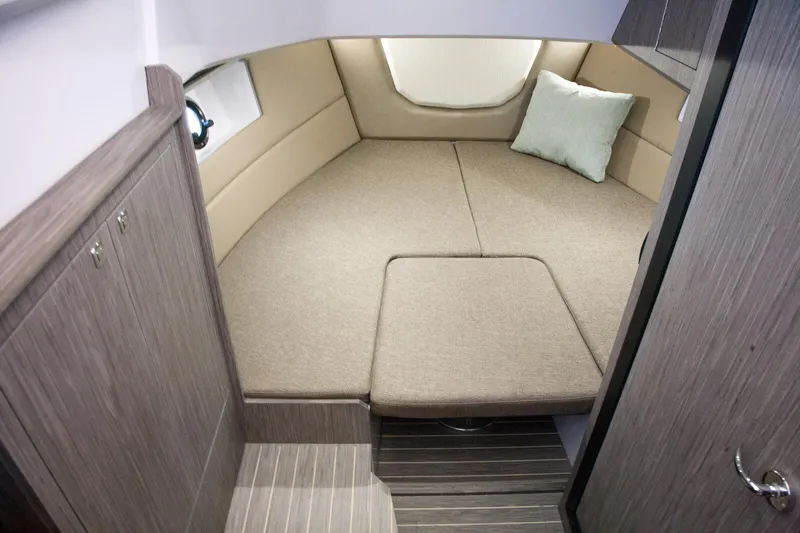 Yacht Photos Pics Interior cabin of 2025 Ranieri NEXT 285 XL boat with beige seating and cushion.