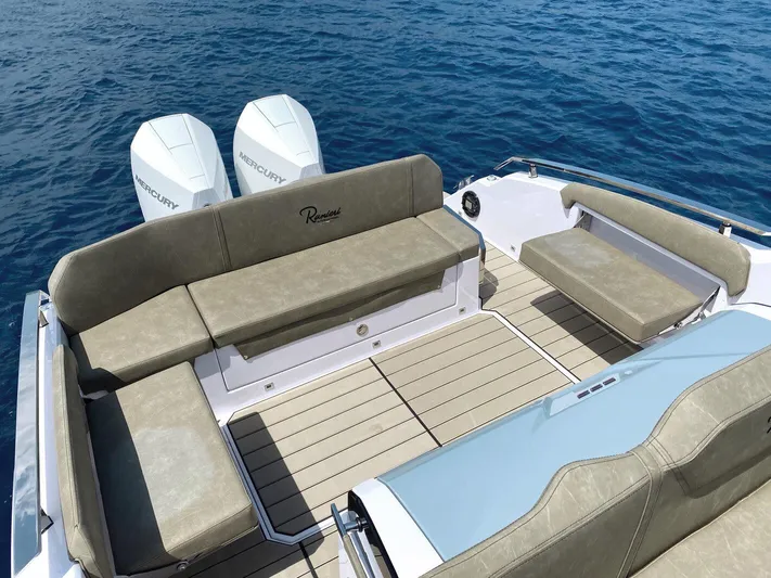  Yacht Photos Pics 2025 Ranieri NEXT 285 XL boat with spacious seating and twin Mercury engines on blue water.