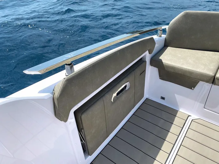  Yacht Photos Pics 2025 Ranieri NEXT 285 XL boat interior with cushioned seating and ocean view.