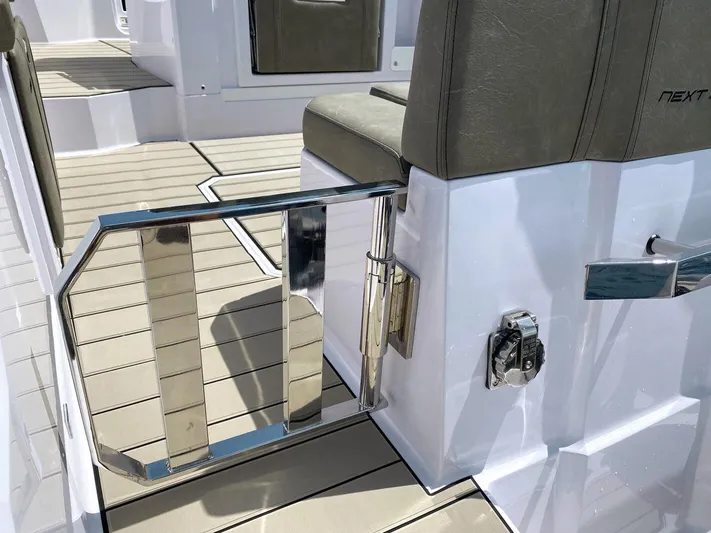  Yacht Photos Pics 2025 Ranieri NEXT 285 XL boat interior with sleek seating and chrome accents.