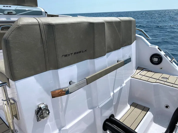  Yacht Photos Pics 2025 Ranieri NEXT 285 XL boat interior, featuring sleek seating and modern design on open water.