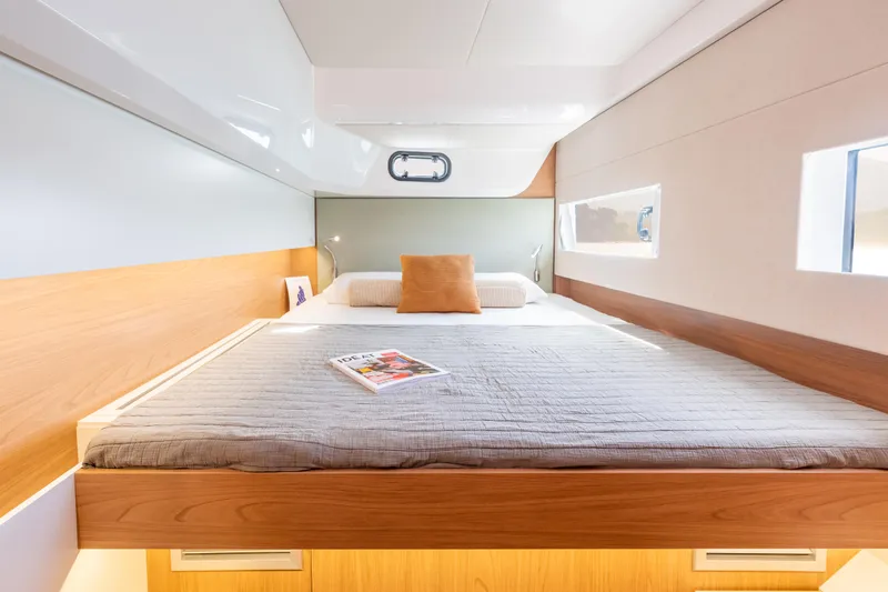 Tbd Yacht Photos Pics Luxurious cabin interior of 2026 Bali CATSMART yacht with cozy bed and modern design.