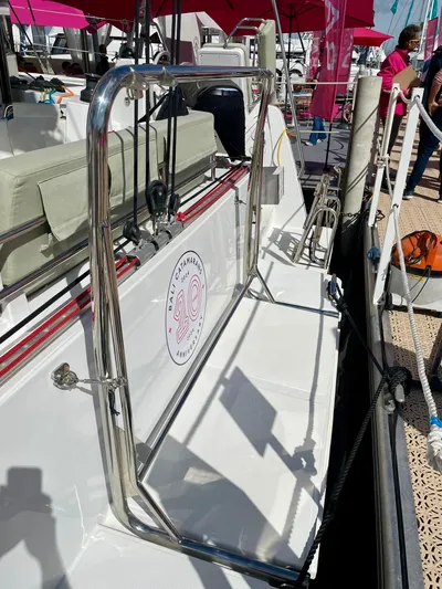 Tbd Yacht Photos Pics Bali CATSMART 2026 yacht deck with chrome railing and logo, docked at marina.