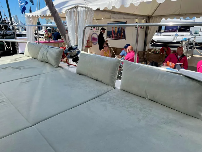 Tbd Yacht Photos Pics Luxurious Bali CATSMART 2026 yacht deck with comfortable seating at a marina event.