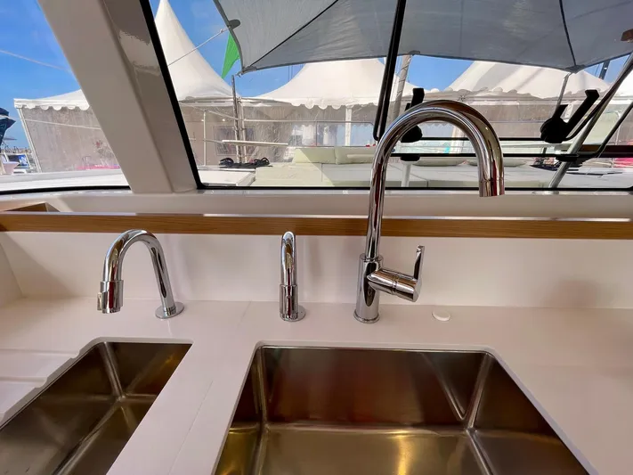 Tbd Yacht Photos Pics Modern kitchen sink with three chrome faucets on a Bali CATSMART 2026 yacht.