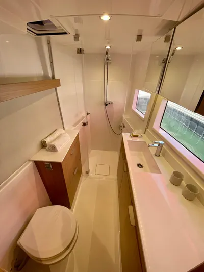 Tbd Yacht Photos Pics Modern bathroom in 2026 Bali CATSMART yacht with sleek fixtures and natural lighting.