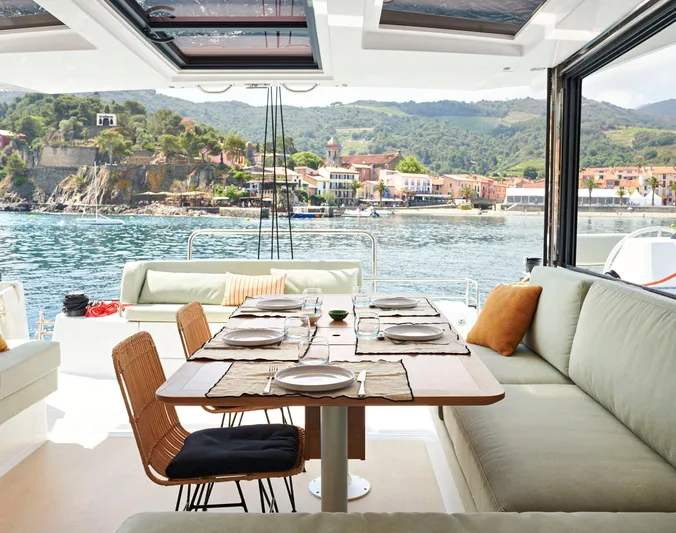 Tbd Yacht Photos Pics Luxurious Bali CATSMART 2026 yacht interior with elegant dining setup, scenic coastal view.