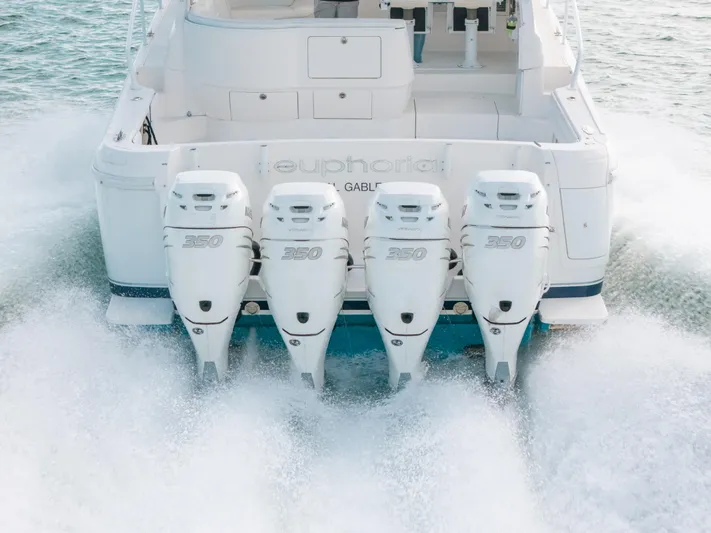  Yacht Photos Pics 2009 Intrepid 475 Sport Yacht with four powerful outboard engines cruising on water.