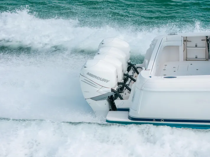  Yacht Photos Pics 2009 Intrepid 475 Sport Yacht cruising with powerful outboard engines on open water.