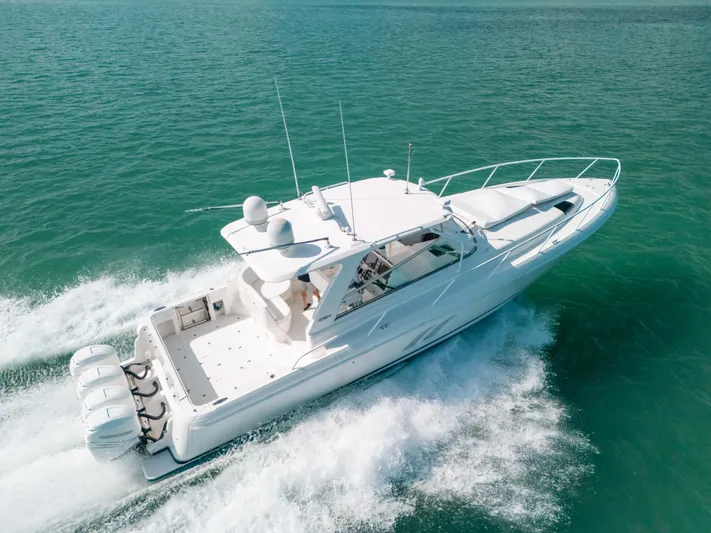  Yacht Photos Pics 2009 Intrepid 475 Sport Yacht cruising on clear blue water.