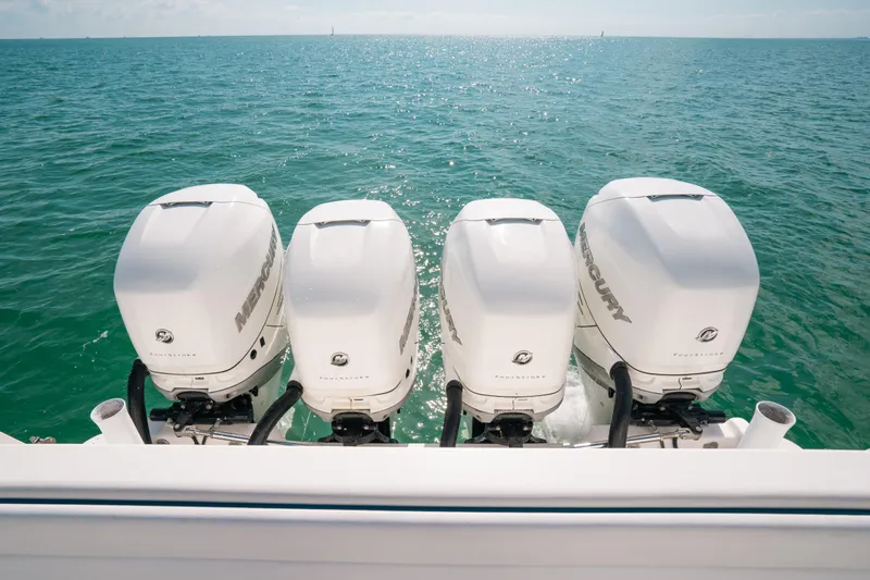  Yacht Photos Pics Four powerful outboard engines on a 2009 Intrepid 475 Sport Yacht, cruising on open water.