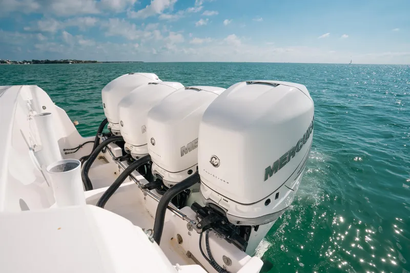  Yacht Photos Pics Triple Mercury outboard engines on a 2009 Intrepid 475 Sport Yacht in open water.