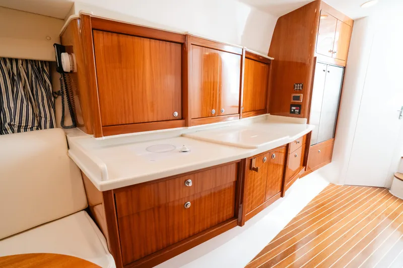  Yacht Photos Pics Luxurious wooden kitchen interior of 2009 Intrepid 475 Sport Yacht.