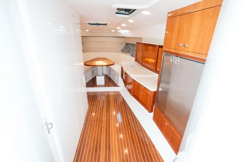  Yacht Photos Pics 2009 Intrepid 475 Sport Yacht interior with wood flooring and modern cabinetry.