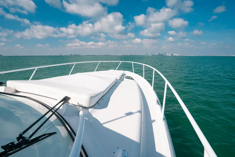  Yacht Photos Pics 2009 Intrepid 475 Sport Yacht cruising on open water under a blue sky.
