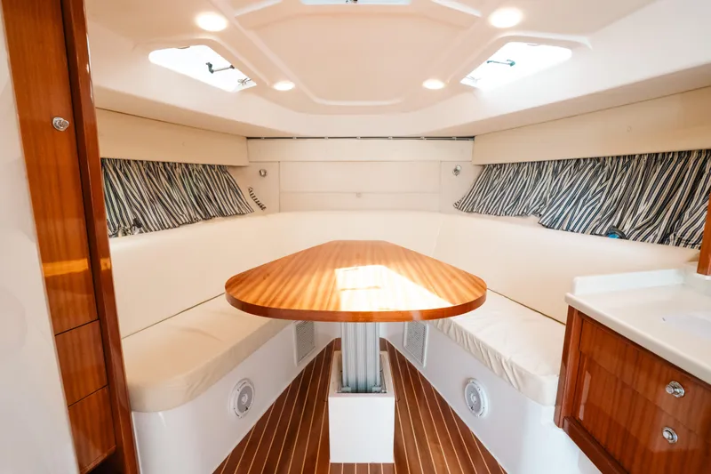  Yacht Photos Pics Luxurious interior of 2009 Intrepid 475 Sport Yacht with elegant wood finishes.