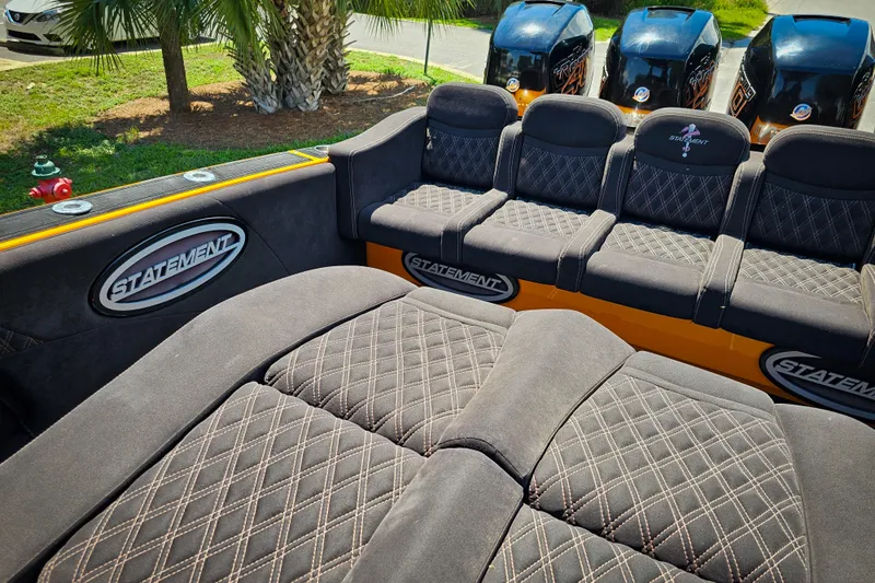  Yacht Photos Pics Luxurious seating on 2016 Statement 380 Open boat with quad engines, palm trees in background.