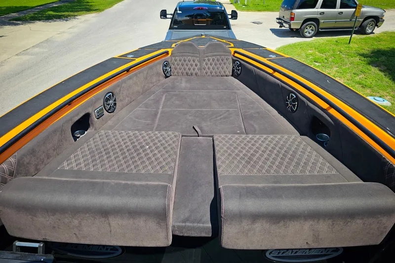  Yacht Photos Pics Luxurious interior of 2016 Statement 380 Open boat with plush seating and speakers.