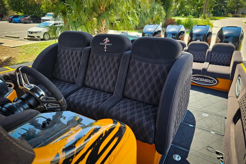  Yacht Photos Pics Luxurious interior of 2016 Statement 380 Open boat with plush seating and sleek design.