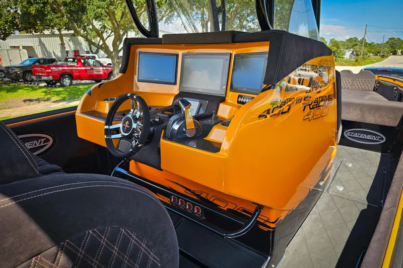  Yacht Photos Pics Interior of a 2016 Statement 380 Open boat with modern dashboard and steering wheel.