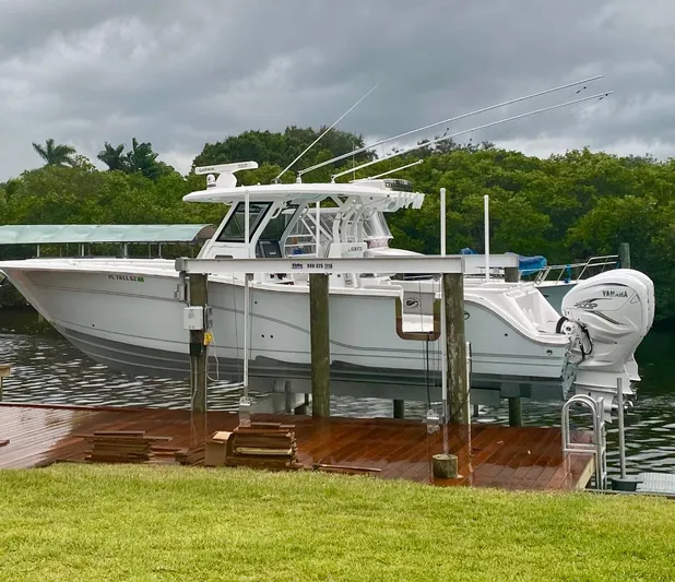  Yacht Photos Pics 2021 Sea Fox 368 Commander boat docked with Yamaha engines, under cloudy skies.