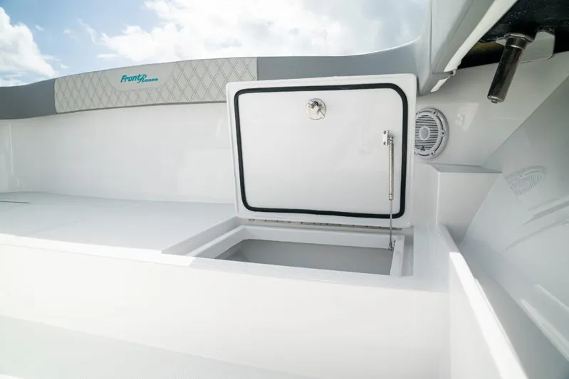 Yacht Photos Pics 2026 Front Runner 37 Catamaran storage compartment with open hatch, showcasing sleek design.