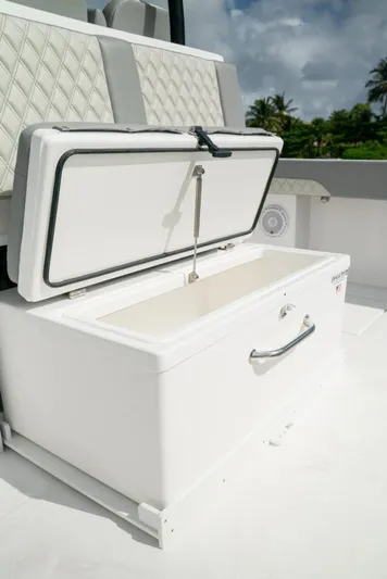  Yacht Photos Pics Open storage compartment on 2026 Front Runner 37 Catamaran, featuring quilted seating and tropical backdrop.