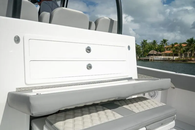  Yacht Photos Pics 2026 Front Runner 37 Catamaran interior seating and storage, featuring sleek design and coastal backdrop.