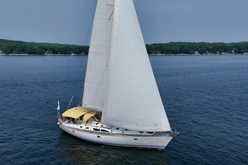 Free Spirits Yacht Photos Pics Jeanneau Sun Odyssey 45.2 sailing on a calm lake, 2000 model.