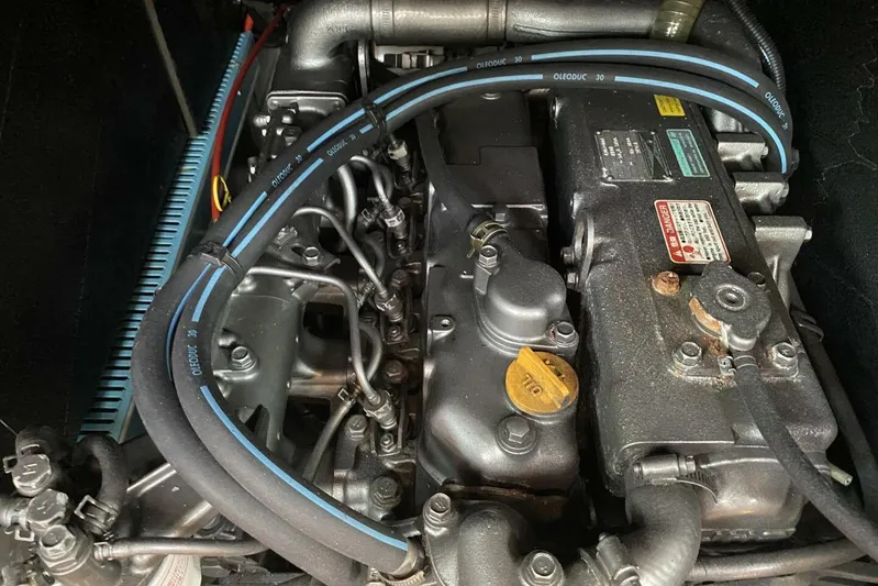 Free Spirits Yacht Photos Pics Engine of a 2000 Jeanneau Sun Odyssey 45.2 sailboat, showcasing detailed components.