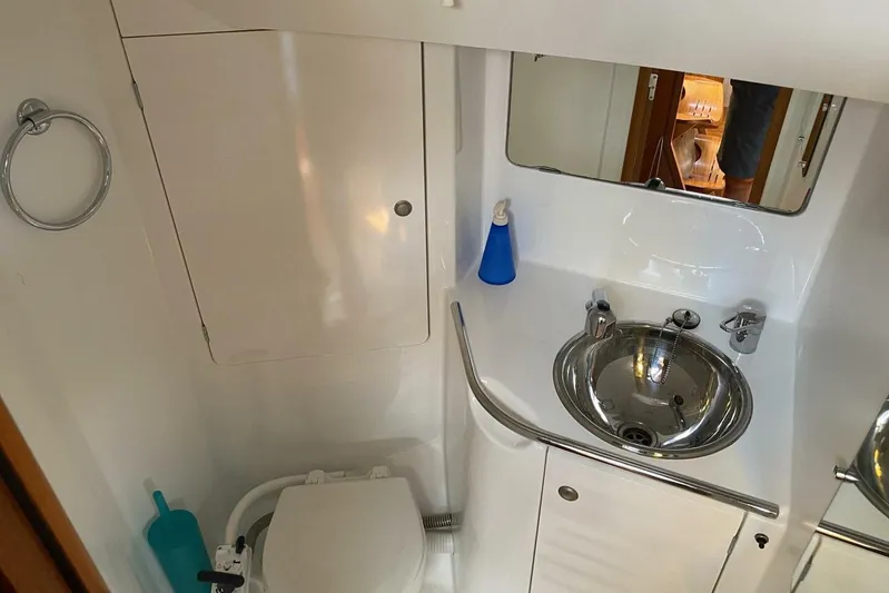 Free Spirits Yacht Photos Pics Bathroom interior of 2000 Jeanneau Sun Odyssey 45.2 yacht with sink and toilet.
